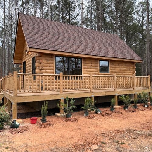 Completed cabin and outdoor deck by Sands Construction Group